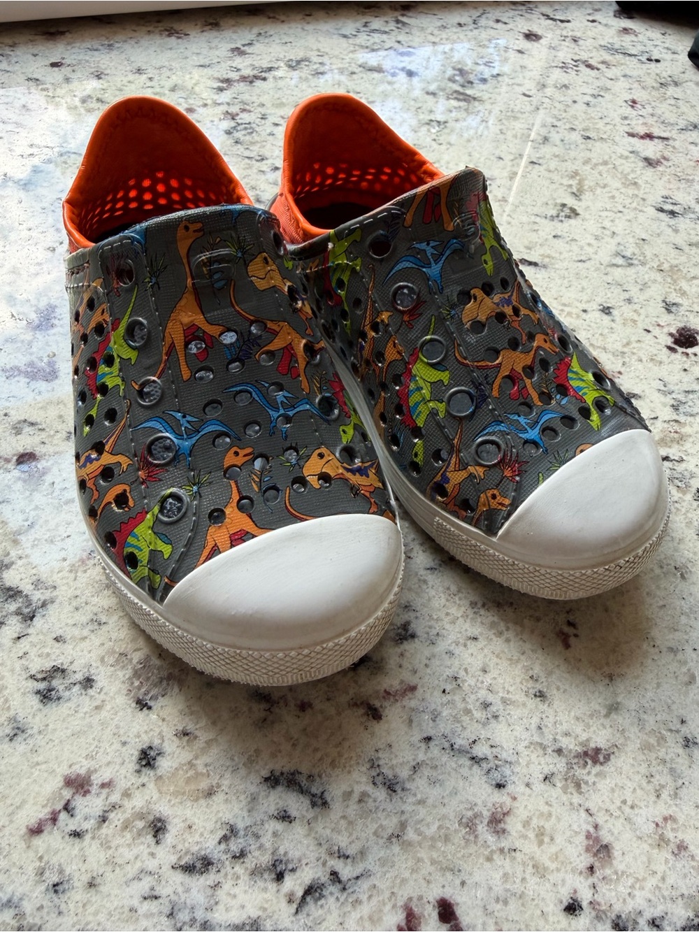 Skechers Kids Dinosaur Slip-On Sneakers in Gray, Orange, Green, Blue